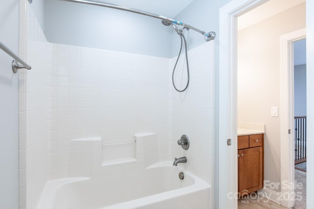 bathroom featuring vanity and shower / tub combination