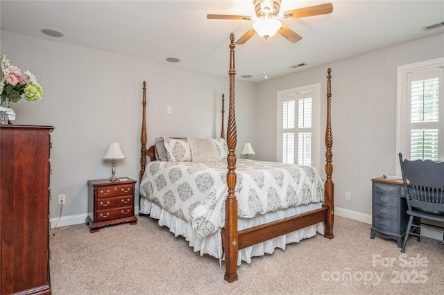 bedroom featuring ceiling fan and light carpet