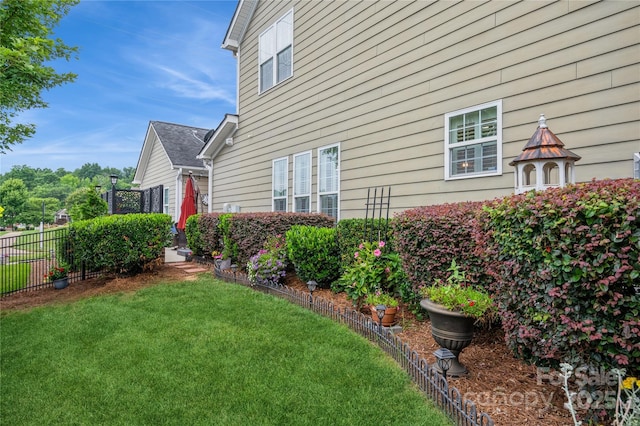 view of home's exterior featuring a lawn