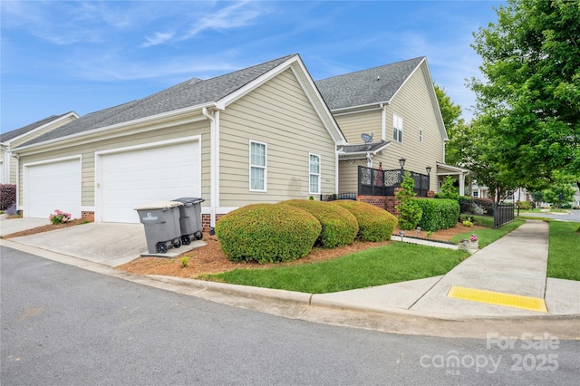 view of side of property with a garage