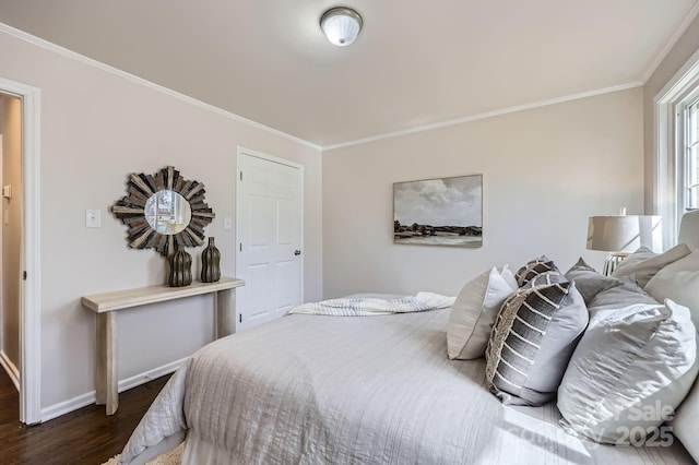 bedroom featuring crown molding, baseboards, and dark wood-style flooring