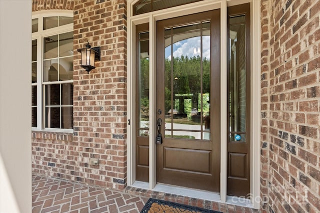 entrance to property with brick siding