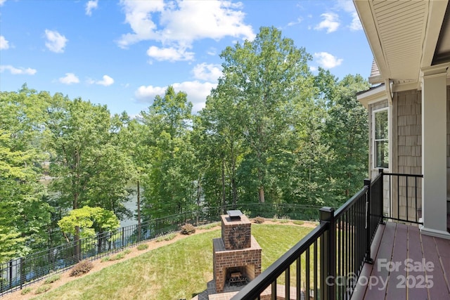 balcony featuring an outdoor brick fireplace