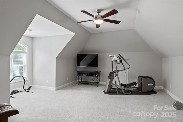 workout area featuring lofted ceiling, carpet, a ceiling fan, and baseboards