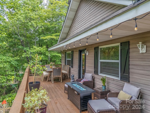 deck with an outdoor fire pit