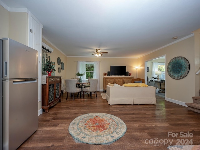 living room with ceiling fan, dark wood-type flooring, and crown molding