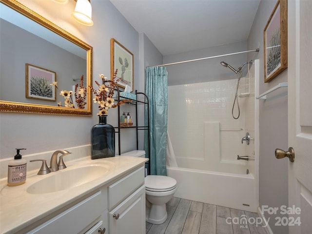 full bathroom with toilet, vanity, and shower / tub combo with curtain