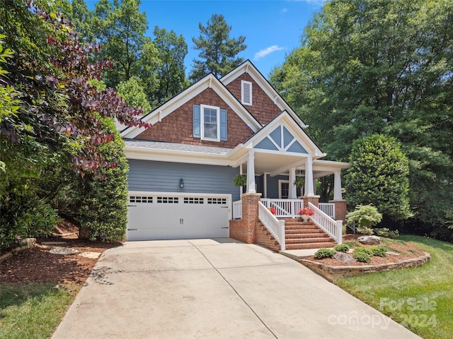 craftsman-style home featuring a porch and a garage