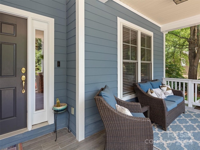 view of exterior entry with covered porch