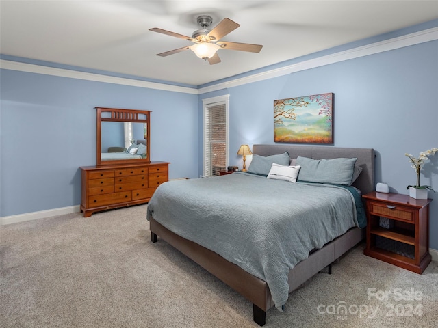 bedroom featuring light carpet, ceiling fan, and crown molding