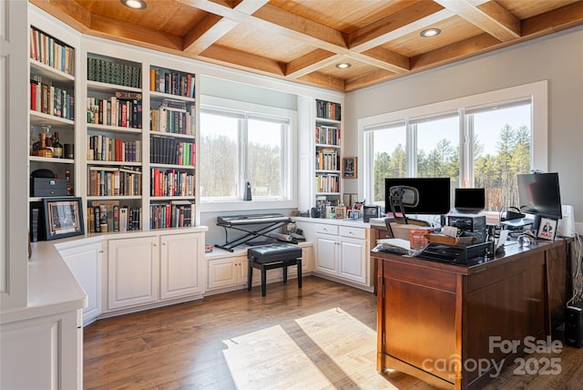 home office featuring light wood-type flooring, beamed ceiling, coffered ceiling, and wooden ceiling