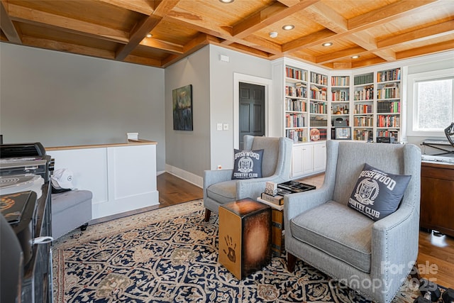 living area featuring built in features, hardwood / wood-style flooring, wooden ceiling, beam ceiling, and coffered ceiling