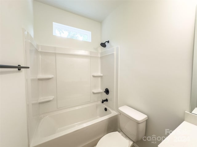 bathroom featuring bathtub / shower combination and toilet