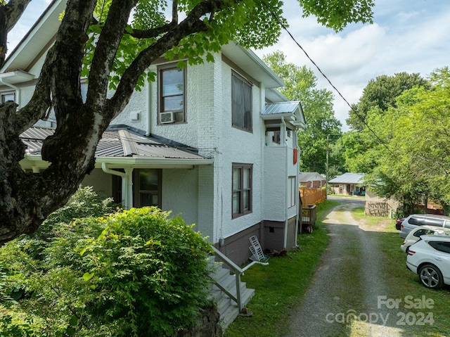 view of side of property featuring cooling unit