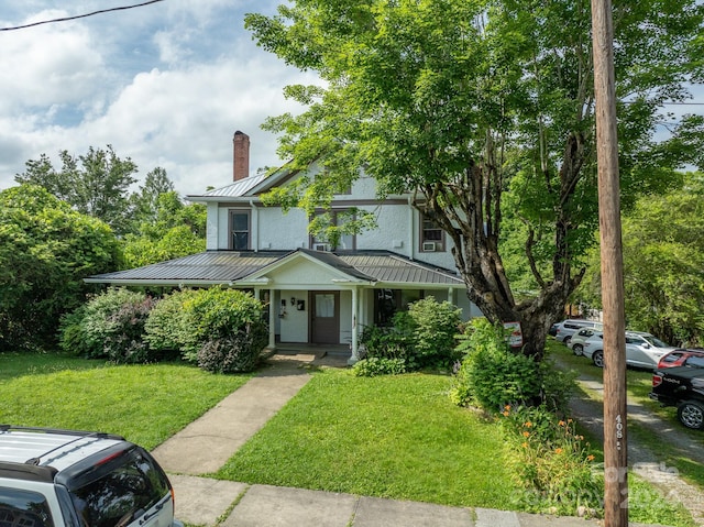 view of front of house with a front lawn and a porch