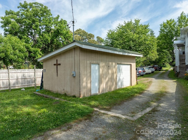 view of outbuilding with a garage