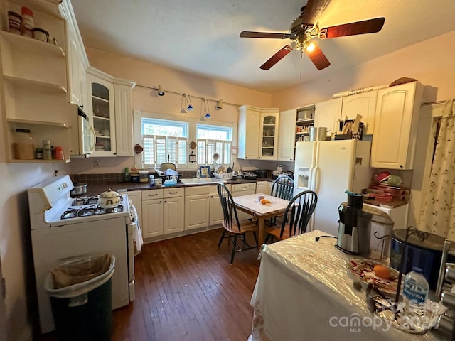 kitchen with ceiling fan, dark wood-type flooring, white appliances, and white cabinets