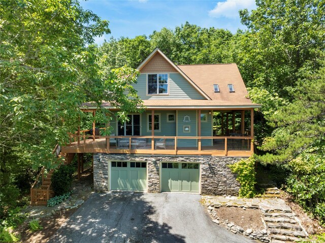 view of front of home featuring a garage and a deck