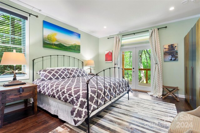 bedroom featuring french doors, crown molding, wood-type flooring, and access to outside