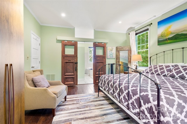 bedroom with ornamental molding, recessed lighting, visible vents, and wood finished floors