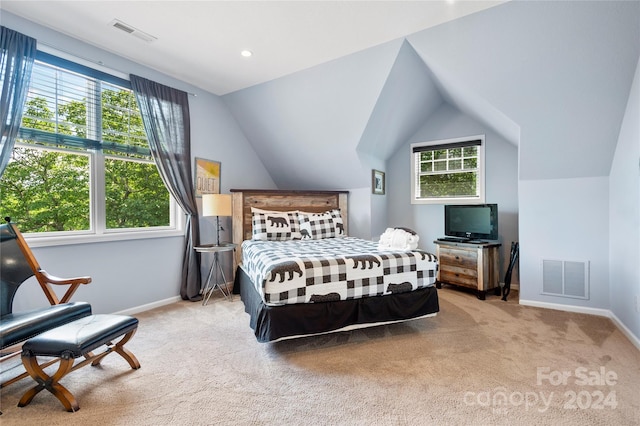 bedroom with baseboards, visible vents, and light colored carpet