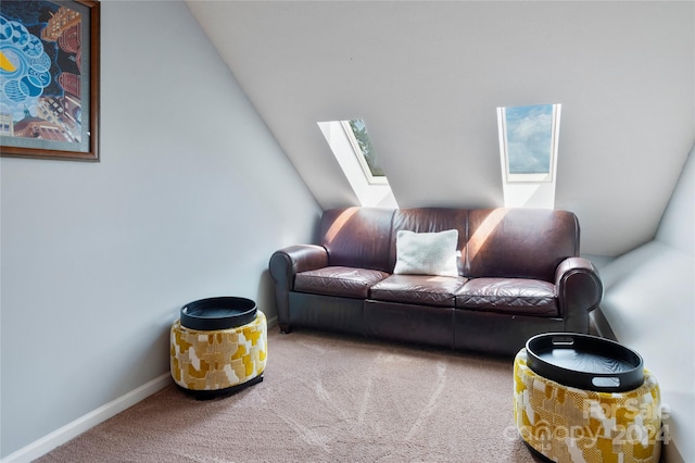 living area with carpet floors and a skylight