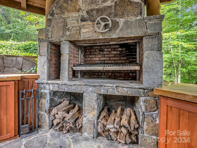 exterior space featuring an outdoor stone fireplace