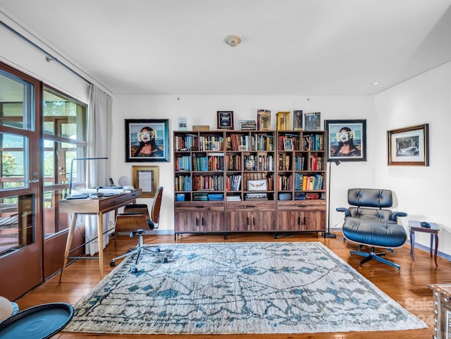 sitting room with hardwood / wood-style floors