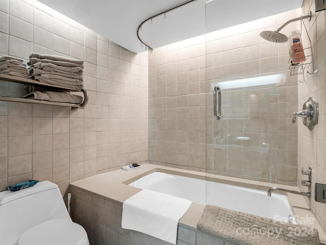 bathroom featuring toilet and enclosed tub / shower combo