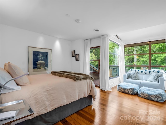 bedroom with wood-type flooring