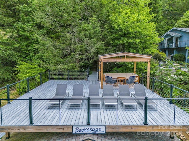 wooden terrace with outdoor lounge area