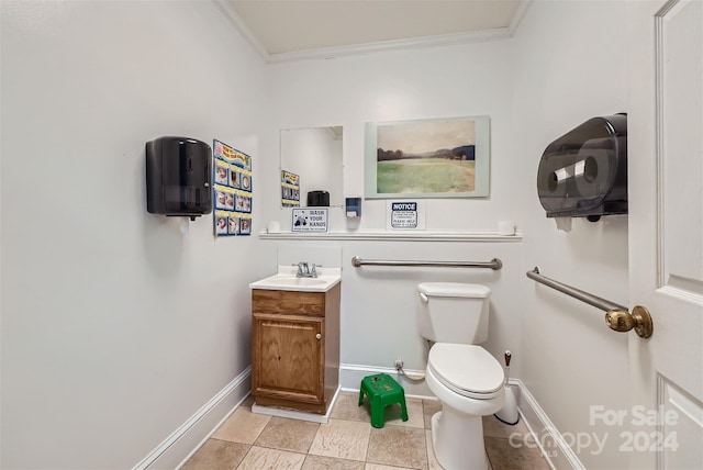 bathroom featuring crown molding, tile patterned flooring, vanity, and toilet