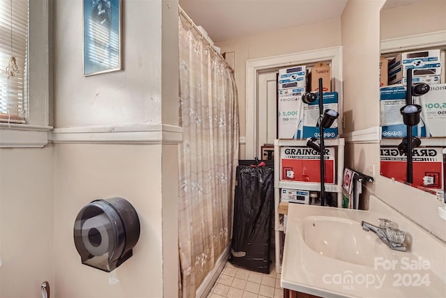 bathroom featuring tile patterned flooring and vanity