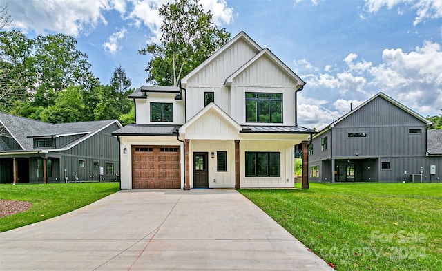 modern farmhouse style home featuring a front lawn, a garage, central air condition unit, and a porch