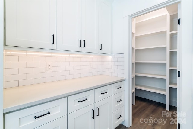 kitchen featuring light countertops and white cabinetry