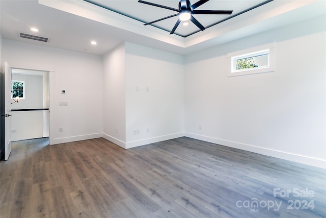 empty room with baseboards, visible vents, dark wood-type flooring, and recessed lighting