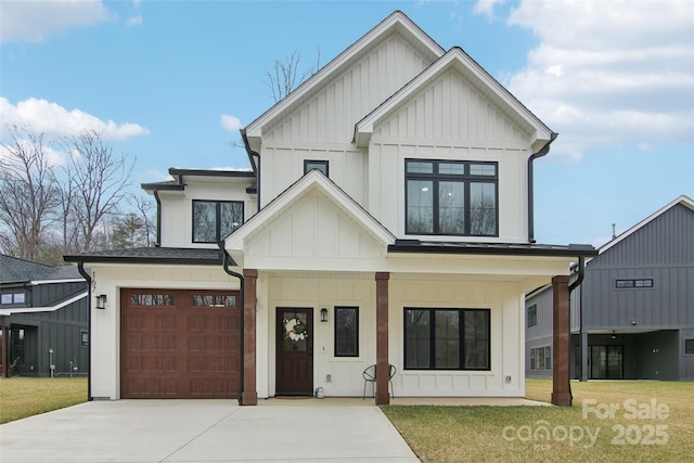 modern farmhouse style home featuring board and batten siding, a porch, concrete driveway, a front yard, and an attached garage