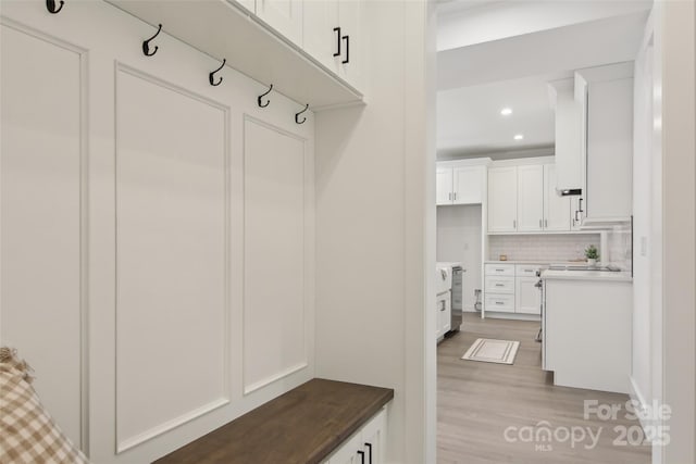mudroom featuring recessed lighting and light wood-style flooring