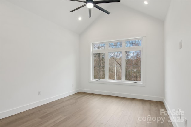 spare room featuring recessed lighting, wood finished floors, and baseboards