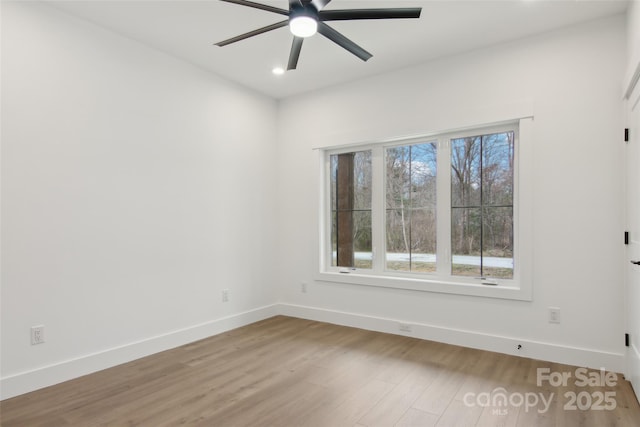 empty room featuring ceiling fan, baseboards, wood finished floors, and recessed lighting