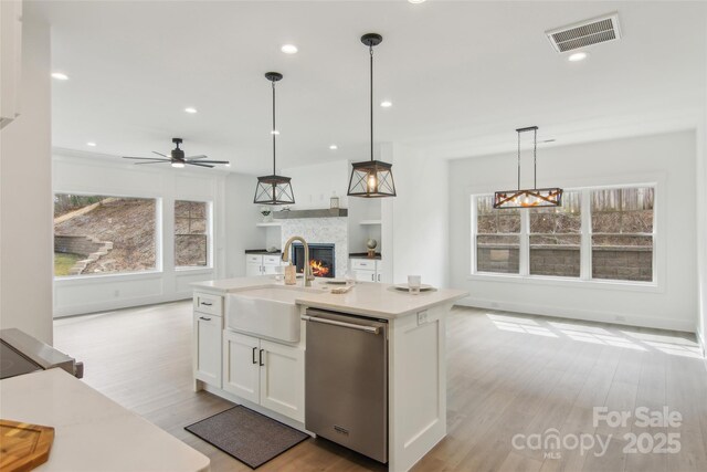 201 Plato Pl, Etowah, NC 28729 - kitchen featuring visible vents, white cabinetry, a sink, dishwasher, and open floor plan
