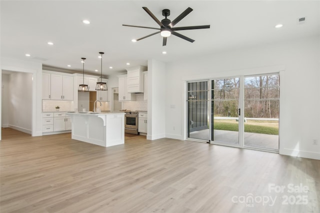 201 Plato Pl, Etowah, NC 28729 - unfurnished living room featuring visible vents, recessed lighting, light wood-type flooring, and baseboards