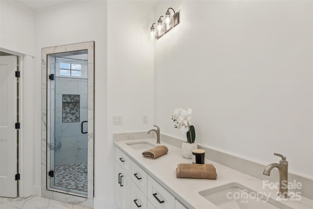 201 Plato Pl, Etowah, NC 28729 - bathroom featuring double vanity, marble finish floor, a shower stall, and a sink