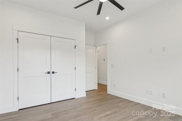 201 Plato Pl, Etowah, NC 28729 - unfurnished bedroom with a closet, recessed lighting, baseboards, and light wood finished floors