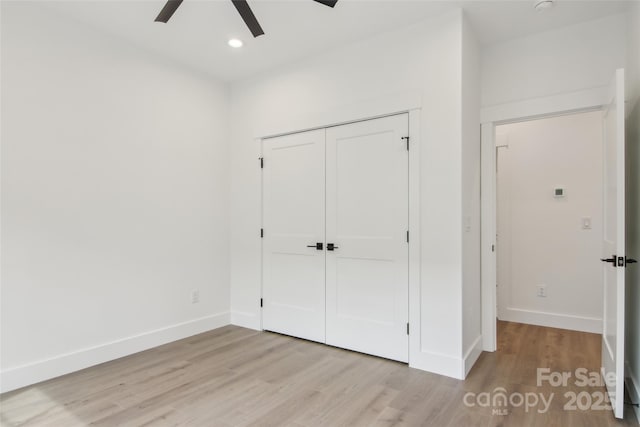 201 Plato Pl, Etowah, NC 28729 - unfurnished bedroom featuring recessed lighting, light wood-style floors, baseboards, and a closet