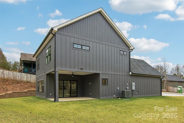 201 Plato Pl, Etowah, NC 28729 - rear view of house with board and batten siding, fence, roof with shingles, a yard, and a patio