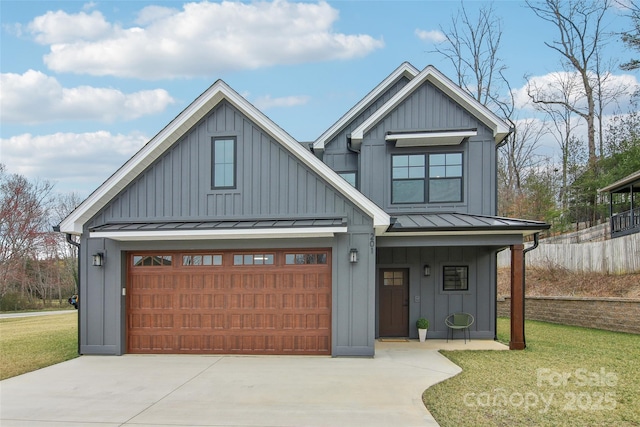 modern inspired farmhouse with a standing seam roof, a front lawn, and board and batten siding