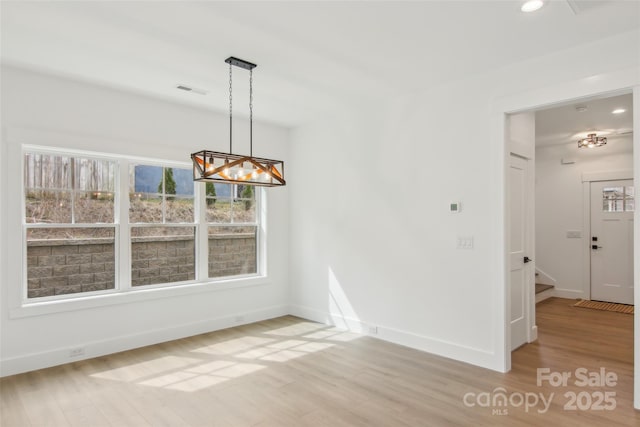 201 Plato Pl, Etowah, NC 28729 - unfurnished dining area featuring visible vents, baseboards, stairway, light wood-type flooring, and recessed lighting