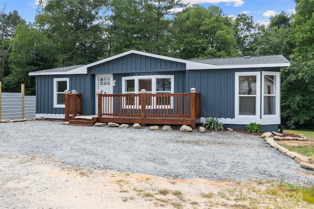 view of front of property with a wooden deck