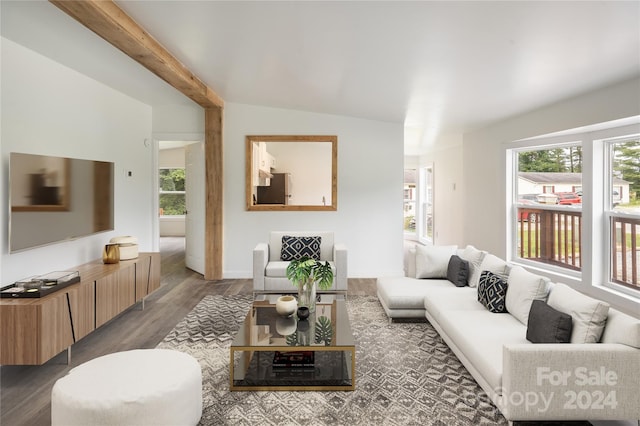 living room with vaulted ceiling with beams and dark hardwood / wood-style flooring